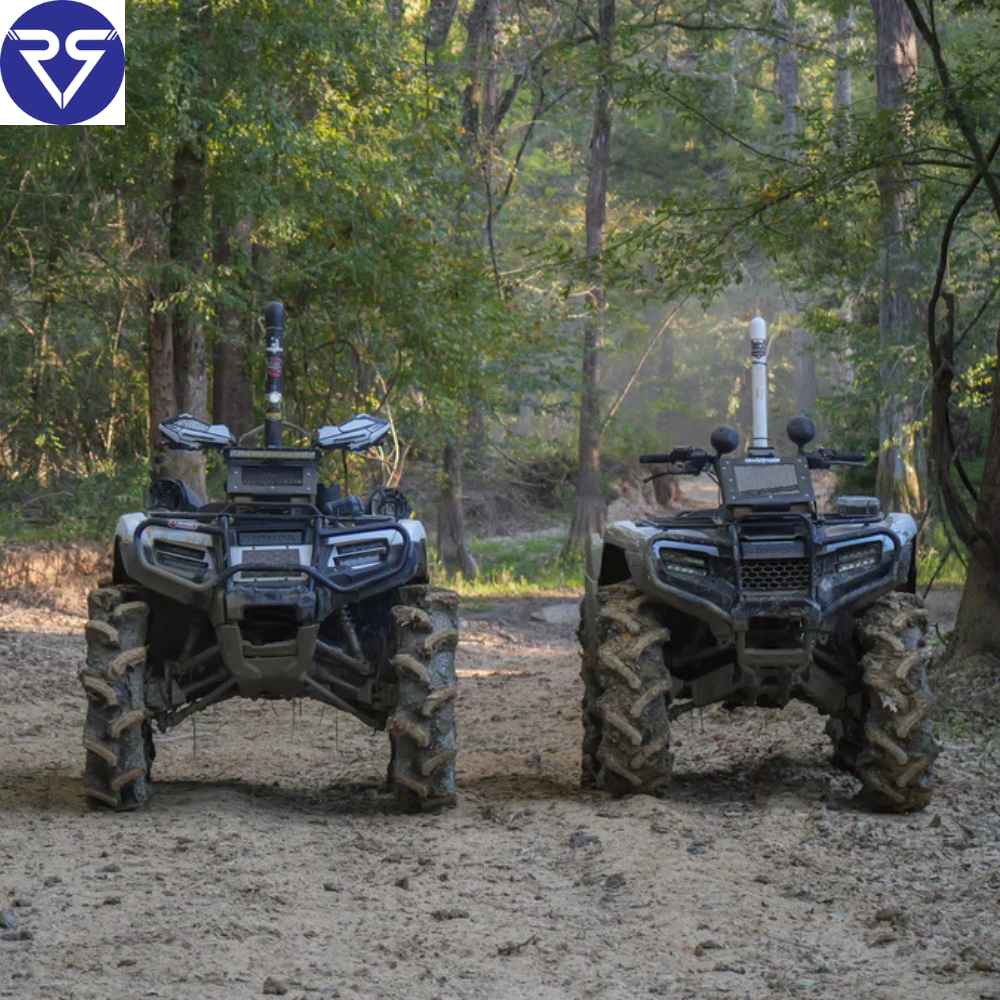 Two lifted Honda ATVs with mud tires parked on forest trail, featuring snorkels and off-road upgrades, ready for rugged trail riding adventure.