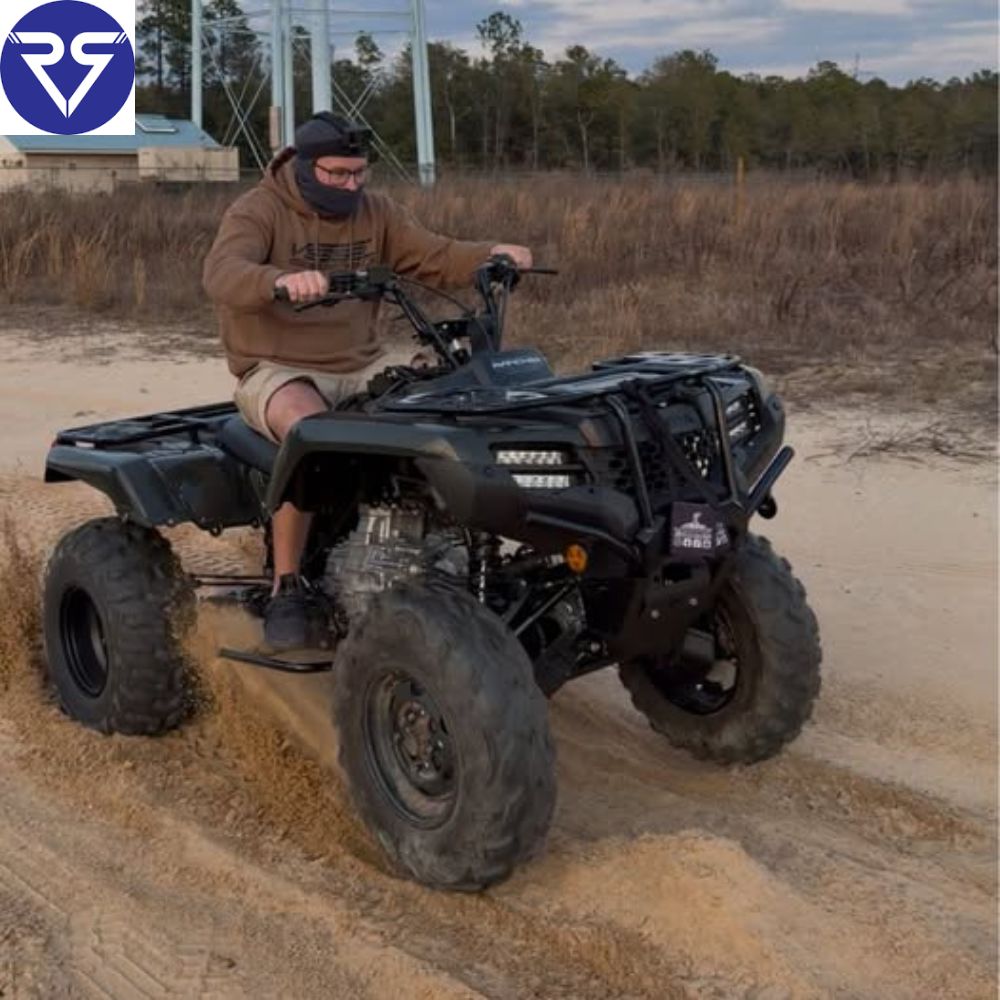 a man driving a black Honda rancher 