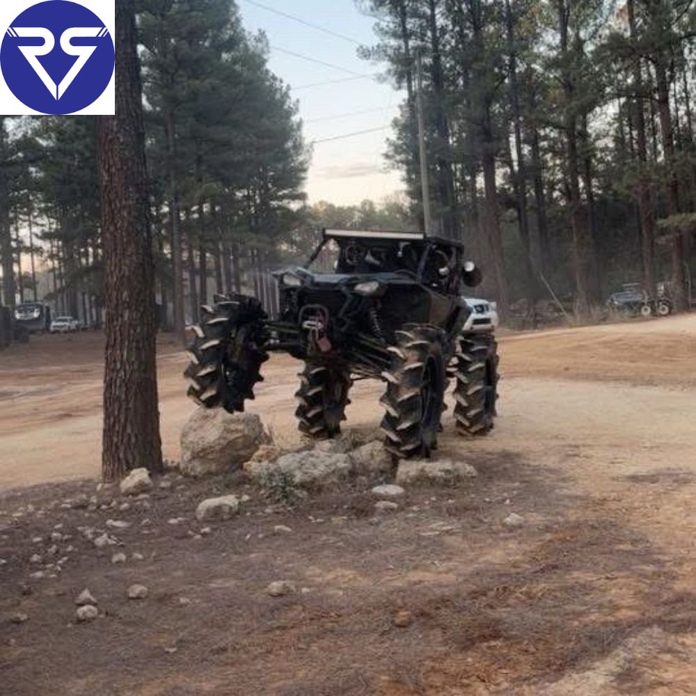 Black Honda ATV near a tree