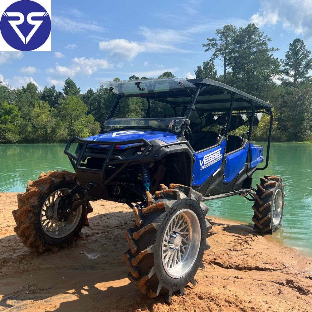 Blue Honda ATVstanding near water body