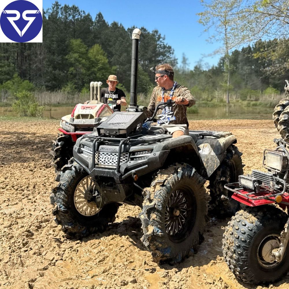 Man driving a black Honda ATV