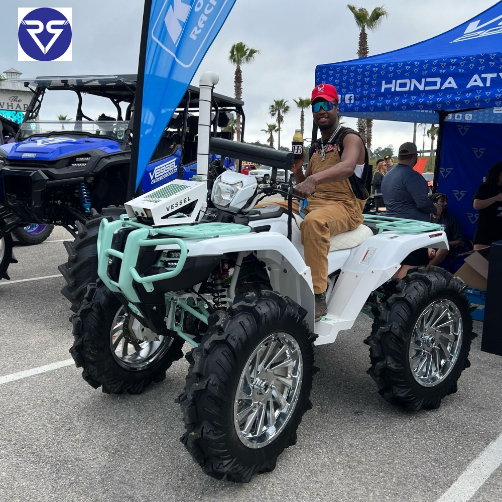 a man riding honda ATV