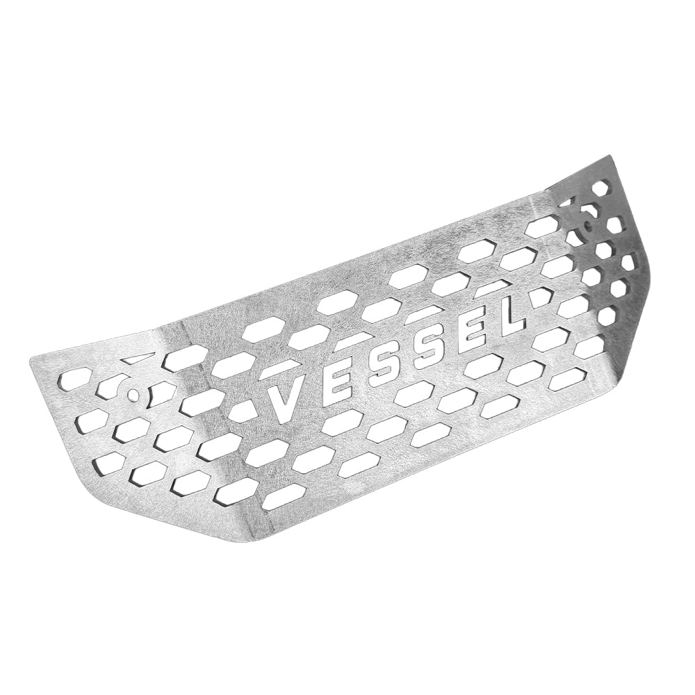 Metallic grill with 'Vessel' branding on a white background