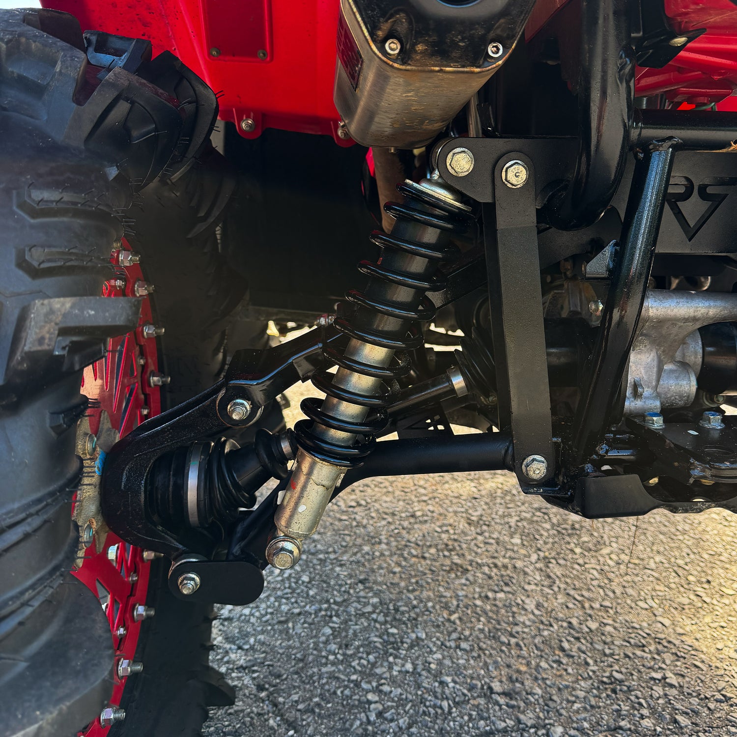 Arched lower control arms installed on Honda Rubicon IRS ATV
